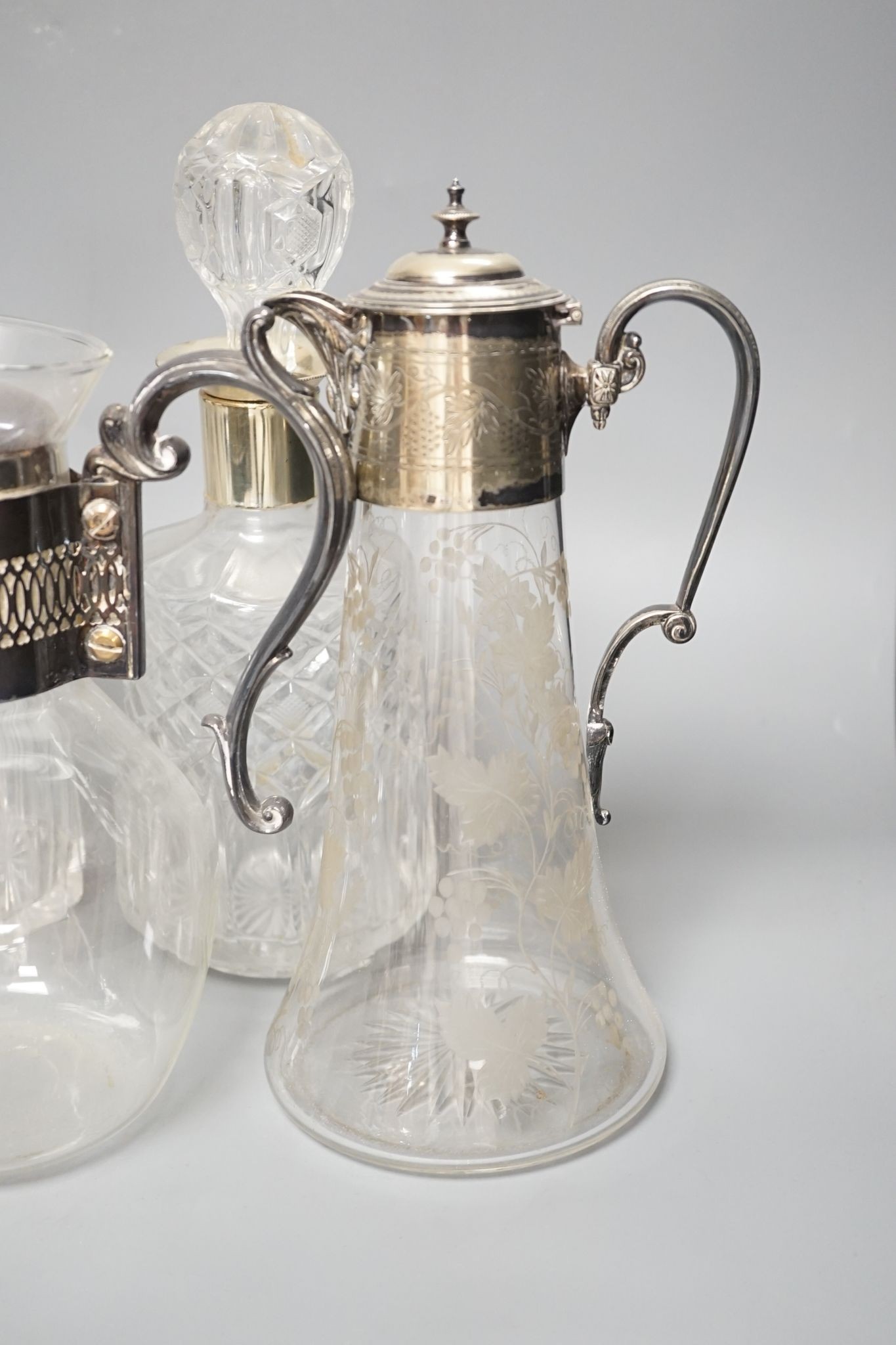 A Hukin and Heath claret jug and other decanters etc.
